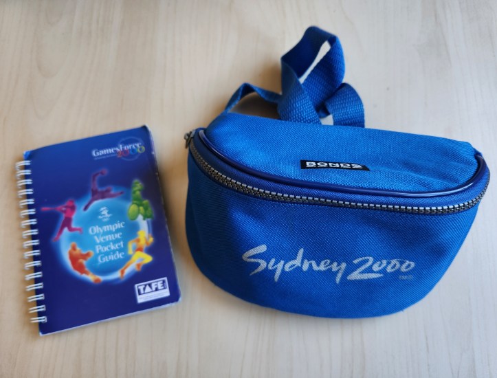 Photograph of Sydney 2000 Olympics venue guide and hip bag