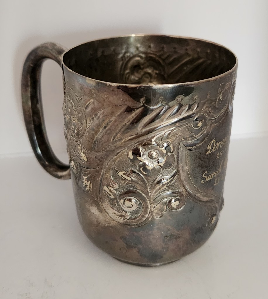 An electroplated silver christening mug