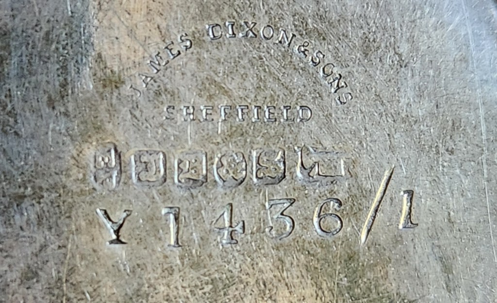 Markings inscribed on the bottom of a christening mug